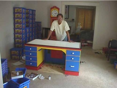 A computer desk... made from LEGO - Approximately 35,000 lego bricks used to make this desk.