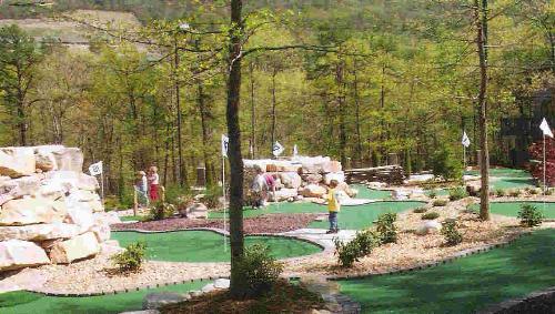 miniature golf - Here is a picture I took of a miniature golf course in Virginia. It was very fun to play. Miniature golf is a blast and love trying to get the ball through or around the obstacles.
