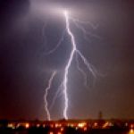 Thunderstorms - A bolt of lightening striking the ground.