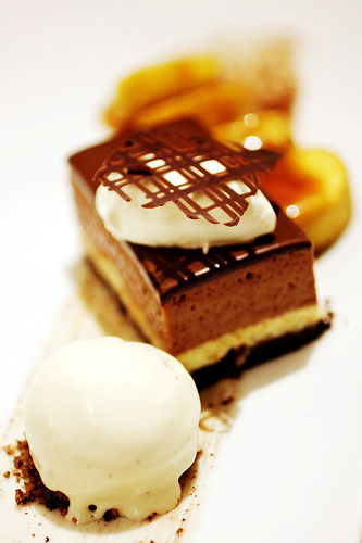 small cake - a small slice of cake with a scoop of ice cream