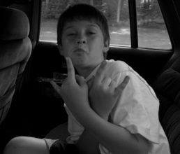 my brother - this is my brother..he is doing the rock on sign. how cute. :D