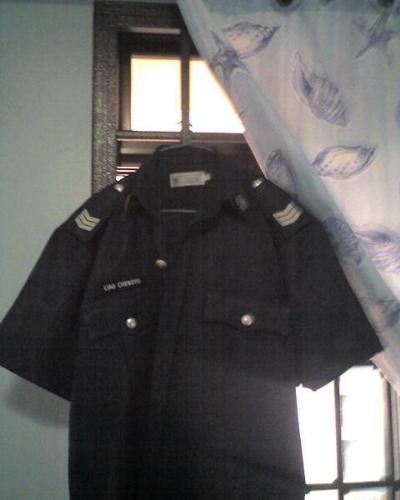 My uniform - This is how's Singapore's police uniform looks like. I was in the police force for 2 years and now I'm back to being a civilian again. My highest rank held was just a sergeant =).