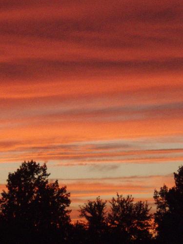 Pretty Sunset - As I walked out the front door of my house one evening, this is the breath taking view before me. I've never been as taken aback as I was when I saw this sunset.