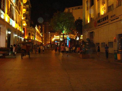 walking street in China - This is a picture of walking street in China, a part of mounting street, you can see the lights everywhere. After supper, many couples,lovers, families are walking along. And there're many figures on two sides, which introduce the cultures and customs in ancient China.