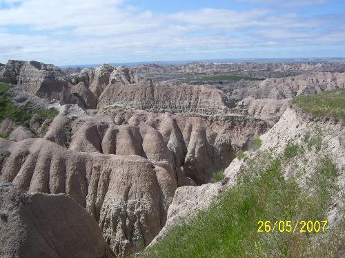 Badlands National Park,South Dakota--a true inspir -  Well I can say this place is one of my favourite travel sight in USA.Located in South Dakota very near to Wall city this rugged terrain formed by the geographical agents of erosion has a truly captivating persona and has a magical and soothing touch to our senses.The spectacular bands of colors displayed against tha backdrop of rough and rugged granite mass reflects natures amazing talent as a sculptor/artist and a painter as if it has displayed an exhibition of its exquisite creations-the masterpieces of a genius mind all in Badlands.