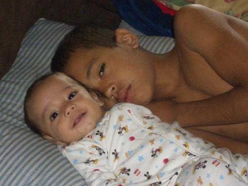 My boys - I woke up on a Saturday morning and my older son had taken the baby out of his room to watch cartoons. This is how I found them.