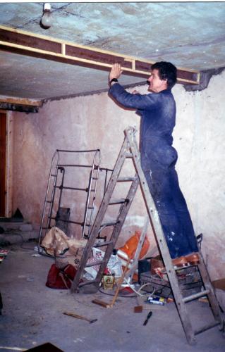 New RSJ (girder) gone up in living room.  - I have just fitted the RSJ (steel girder) across the ceiling of the sitting room and here I am boxing it in to look like a wooden beam.