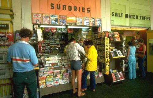 buying from a store - a group of buyers bying things from a shop.