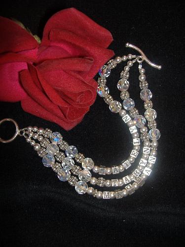Mother's Bracelet - Here is a sample of my handcrafted sterling silver Mother's Bracelet featuring the names of my three daughters. It is made with Swarovski crystals. Custom bracelets are available on my jewelry website: http://www.dazzlingjewelrycreations@comcast.net.