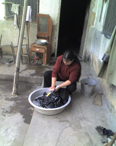 my mother - my mother is washing the clothes