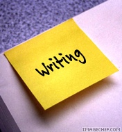 writing post it - a yellow post it on a book with the word writing on the post it