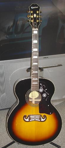 my Epiphone EJ300S - this is my Epiphone EJ300S,it is a copy of a Gibson J200 but costs a lot less.THe EJ300S has a solid spruce top,laminated rosewood back and sides.