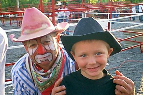 My Son and the Rodeo Clown - This is a picture of my son at the rodeo that comes to town every year. He had a great time, and the clown seemed to pick him out for alot of activities that they do with the young children.