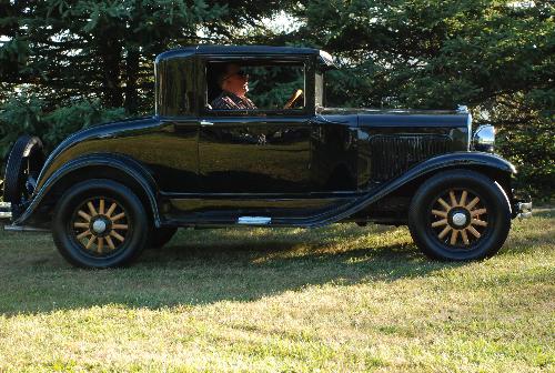 Car Show 2007 - This is one of the photos that my daughter took at the town car show. If you zoom in close enough, you can see her reflection. This vehicle is a 1928 Plymouth and is polished to a high sheen. Car Show 2007 - This is one of the photos that my daughter took at the town car show. If you zoom in close enough, you can see her reflection. This vehicle is a 1928 Plymouth and is polished to a high sheen.