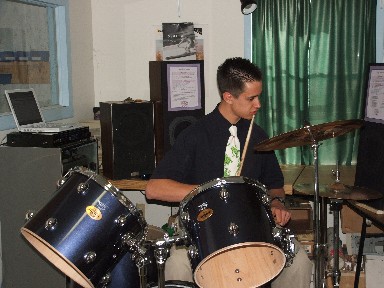 Keep your eye on the drummer. - Here's Mike at home on the drums in his early days. Watch him on YouTube to see what he can do now.