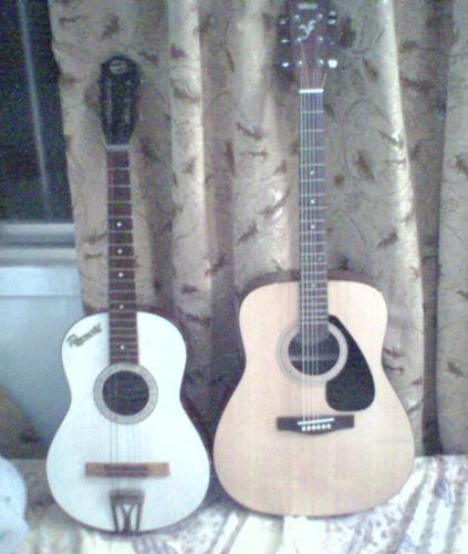 my new guitar in comparison to my old tiny one. - It's a beauty!
