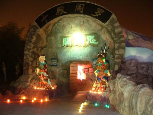 Hungry Ghost Festival - Breaking open the gates of Hell of the 10 courts in Hell in Haw Par Villa by using a proper Taoist ritual. 