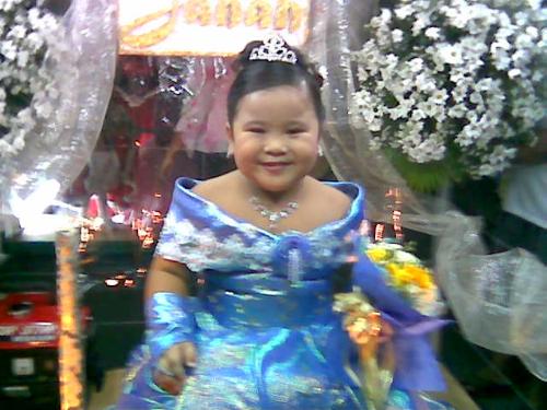 my daughter's festival photo - taken last June 2006, she joined the festival they had a parade. She was all dressed up riding her own float full of flowers.