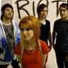 paramore - paramore standing in front of the RIOT sign for their new album.