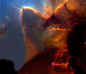 The Trifid Nebula. - A 'stellar nursery', 9,000 light years from here, it is where new stars are being born.