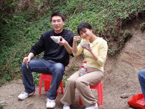 my friend and i - we were mount a Yuelu Mountain,this photo decribes that we took rest on the half way,eating jellied bean curd.