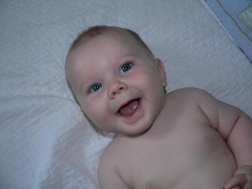 Joel - Here's a pic of our newest little man. What a smile he has, and a great personality to go with it!