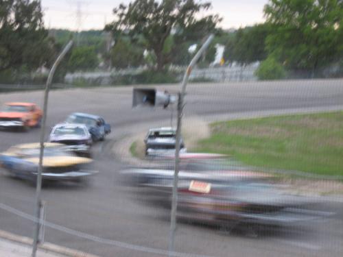 Flag pole Race Action Shot - In the dead center of this photo you can see one driver spun around facing backwards. Great racing action of the flag pole racing.
