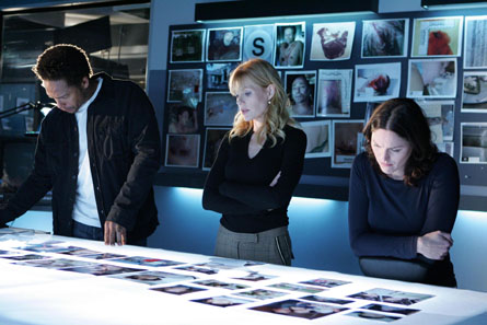CSI Crime Scene Investigation - The cast looking over crime scene photos trying to get a lead on the killer.