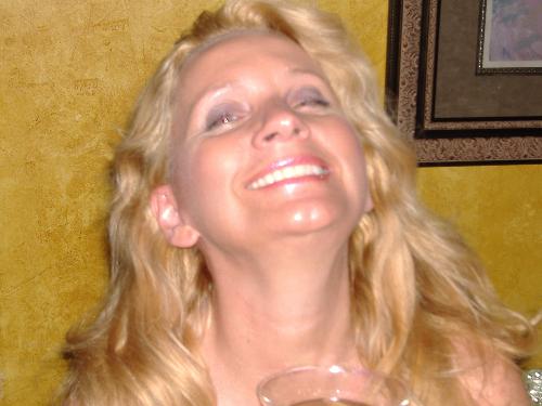 All Smiles - This is a rare pic of me smiling. I had been in the hospital for a long tme due to my disability compliments of the US Army and I had not been able to get out and enjoy myself in the evenings for a very long time. Mike and I went out to a new club and I even drank a few which put some smiles on my face. This is what you see in the picture true smiles after almost a year of being in so much pain I actually smiled for the first time and it felt good and thats the night I earned the nicknamed sparkling eyes.