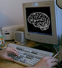 computer brain - image of a computer screen and keyboard, with the stylized image of a brain super-imposed on the monitor screen.