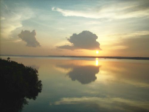 More Reflections - Here is another photo of the cloud formations, just above the water, during a sunset. Just beautiful!