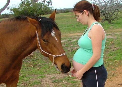 Boney my horse, and me! - My partner took this one for me. Boney's my newest horse, and i love him to bits, he's the nicest natured horse and is always interested in my tummy!
