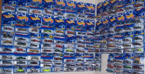 Hot Wheel Cars - There are over 100 cars hanging on the wall.