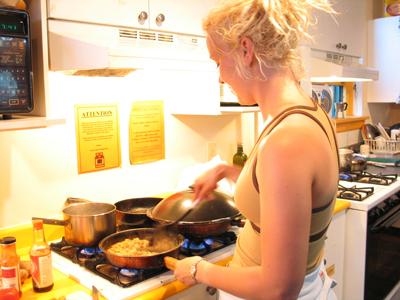 cooking at home - this lady is cooking at home rather than eating out.