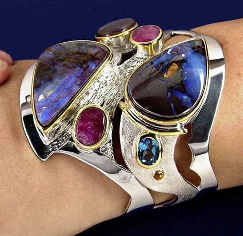 boulder opal and rubies and topaz, sterling silver - sterling and 14K bracelet with 3 big boulder opals, 2 rubies and 2 swiss topaz and several peridots