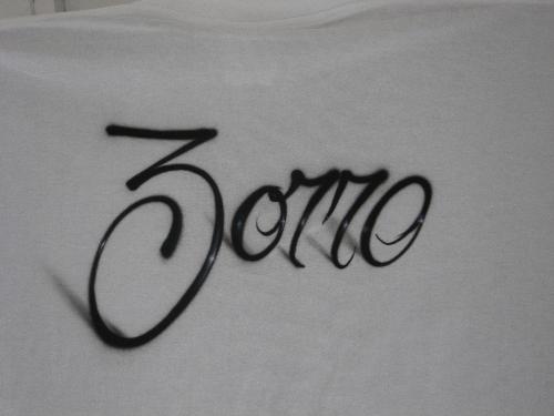 Airbrush art - airbrush lettering on t-shirt.