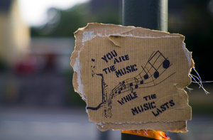 To Play Music - An image and design for the word of term 'to play'. Music chords as an imagery image of a saxaphone
