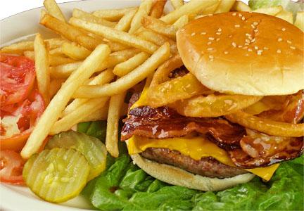 burger and fries - a large patty burger with a bunch of fries