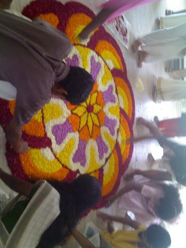 onam festival - check out this flower carpet that we made at our college as part of onam celebration , it actually was a competition ,n this one that we made the first prize. isnt that cool?