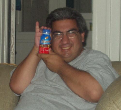 My friend Mike advertising Glucerna - We were goofing around and I took this picture of my friend Mike with my Glucerna [nutritional drink for diabetics] bottle. I call this my Glucerna Advertisement!