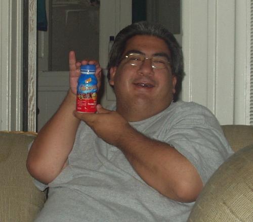 My friend Mike being silly with my Glucerna - We were goofing around and I took this picture of my friend Mike with my Glucerna [nutritional drink for diabetics] bottle. I call this my Glucerna Advertisement!