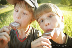 icecream - Two boys making funny faces while eating