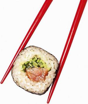 Sushi - eating sushi with chopsticks