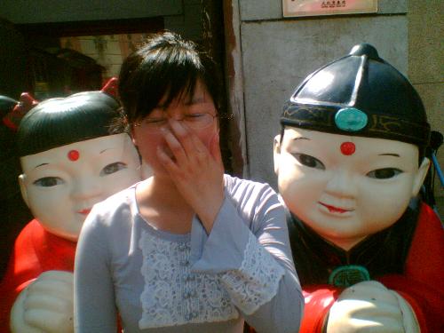 wang fu jing - the beauty in the picture is me. the face is blocked. but it is really a true beauty. hehe. i don't always seperate the difference shopping in different places such as in Beijing or in Qingdao. That is the reason that i couldn't feel much in WANGFUJING. there is also something i remember profoundly. the dumplings are propaganded of its eighteen wrinkles and are named by one famous person who was royal in Qing Danasty. i think what i ate is only the name. the taste is normal and not special.(1)