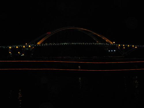 Color of the night - This is a picture of night of the city.  The city has been enveloped in the color of night but is illuminated by the lights which cover the city with different look. YeahO, I love the small city with beautiful scene.