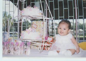 my little angel christening! -  Taken at the reception with her cake. She's alredy 3 mos old and is already a christian. Welcome darling to the christian world! i love you baby..