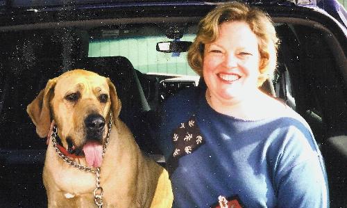 Joan and Jezebel - I'm sutting in the back of our SUV with our previous dog, Jezebel. She was a Fila Braseliero and she was the best dog in the world. There'll never be another one like her, and we still miss her every day.
