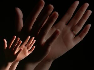 Hands in worship - Stock photo