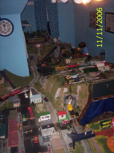 My Lionel layout - This is an arial view of my Lionel layout housed in the finished attic of our house.  It's comprised of nearly 100 sq. feet with 6 continually running trains/motorized units and over a dozen animations.