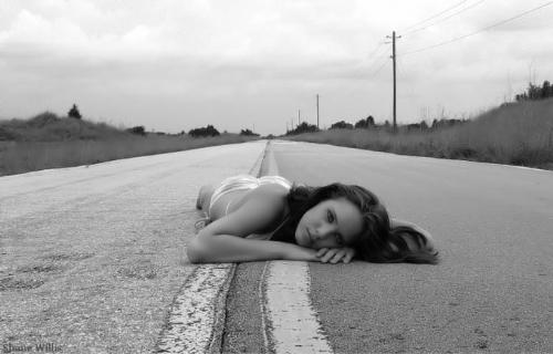 highway - girl lying on the highway